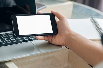 Close up of man hand holding smart phone.