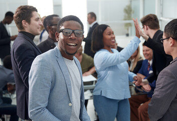 Obraz premium Portrait of happy businessman during conference in office