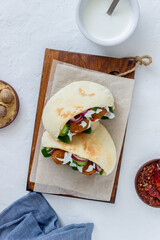 Falafel in pita with tomatoes, cucumbers, onions and spinach. Healthy eating. Vegetarian food.