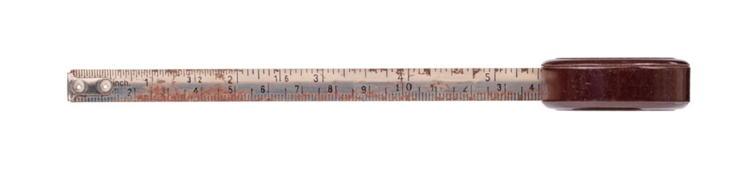 Old scratched brown metal tape measure