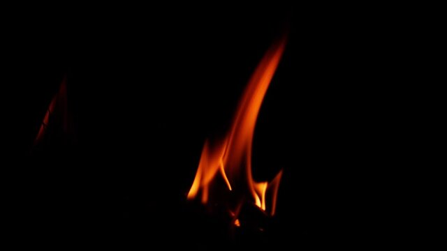 View of a single fire flame with black background