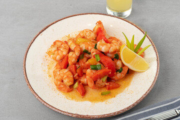 Stir fried seafood with sauce on plate with napkin