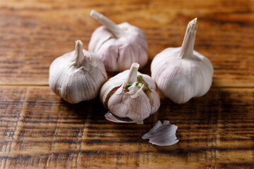 Close-up of garlic bulbs on a wooden table. Cooking concept.