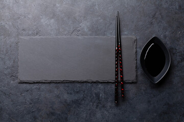 Stone plate and chopsticks for your sushi and maki © evgeeenius