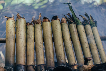 Cooking rice in a bamboo cylinder