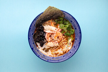 Closeup on asian ebi ramen noodle soup with mushrooms and shrimp