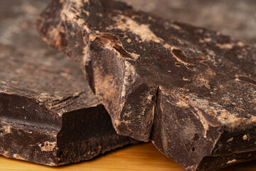 Pieces of natural dark chocolate close up
