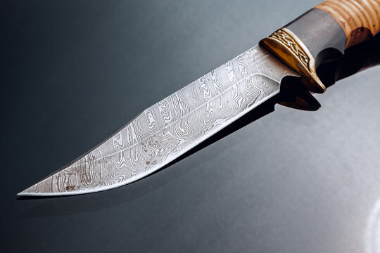 Hunting Knife On Black Background With Reflection