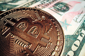 Bitcoin on american dollar banknote close up