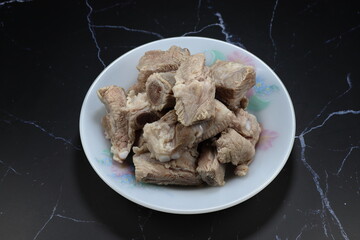 Pile of classic steamed pork rib serving on the plate. 