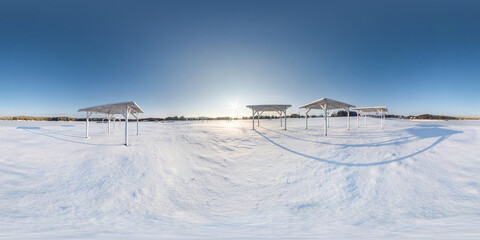 Winter full spherical seamless panorama 360 degrees angle view snow covered deserted beach with...
