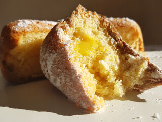 A piece of pandoro with lemon cream. Macro.