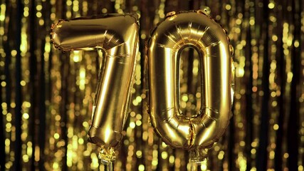 The golden number 70 seventy is made from an inflatable ball on a yellow background. One of the complete set of numbers. Birthday, anniversary, date concept - Powered by Adobe