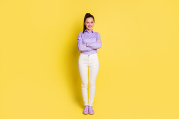 Fototapeta na wymiar Full length body size photo young business woman smiling with crossed hands isolated on bright yellow color background