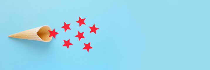 Waffle cone with red stars on blue background