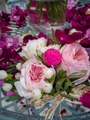 A bouquet of charming roses pink and red on the table
