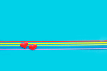 LGBT community pride rainbow ribbon awareness on blue background.