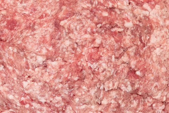 Raw minced meat texture background. Chopped meat background.  fresh raw ground pork heap. Top view.