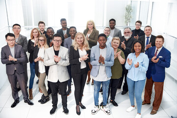 Fototapeta premium group of diverse corporate employees applauding together .