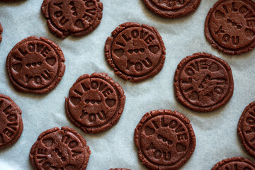 Food pattern. Raw chocolate cookies with sign I love you. Top view. Flat lay. Valentines day celebration concept