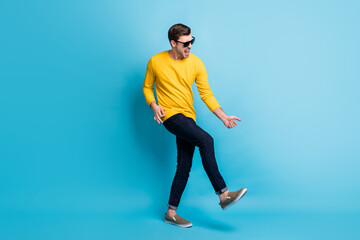 Full length profile photo of crazy handsome person play imagine guitar open mouth shout isolated on blue color background