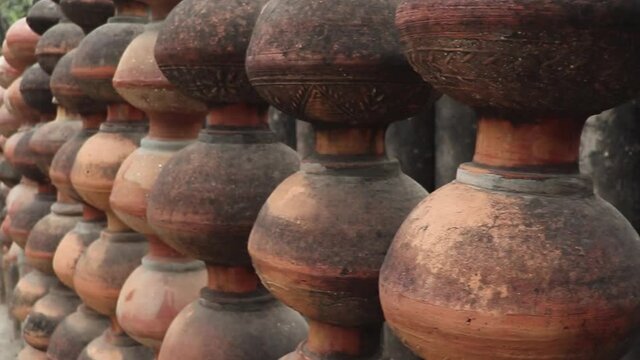 handmade pots stacked together on each other.