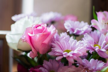 A bouquet of flowers in pink and purple tones, close-up.