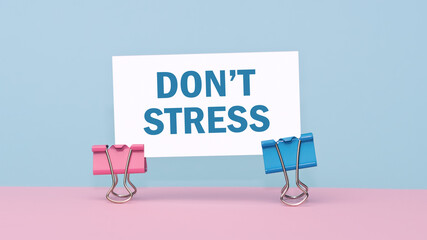 DonT Stress - concept of text on business card on pink and blue background