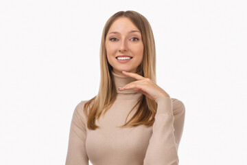 Naklejka premium Pensive blond girl with thoughtful expression, keeps hand on chin, plans something or makes choice