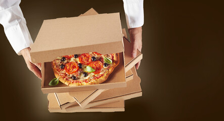 Anonymous delivery man with boxes with pizza