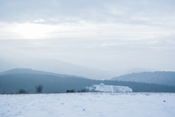 View from a hill on snowy landscape