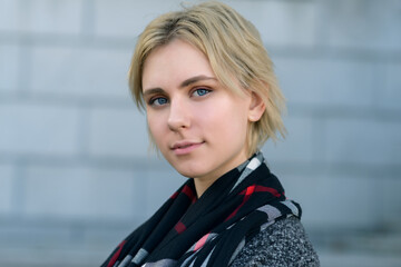 Autumn portrait of young woman in a coat. Selective focus.