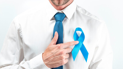 November. Hipster men in bright shirt, cyan tie with blue ribbon in hands on white background....