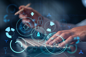 Hands typing the keyboard to create innovative software to change the world and provide a completely new service. Close up shot. Hologram tech graphs. Concept of Dev team. Formal wear.