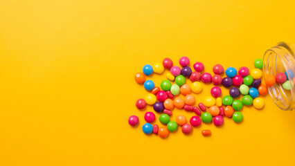 colorful little candies on a colored background