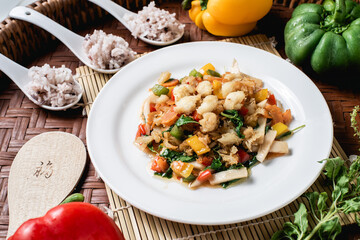 Crab meat fried bell pepper on the wooden background.