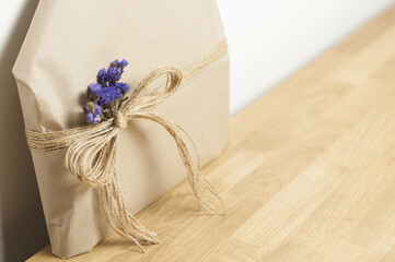 Gift in a cardboard box with a bow. St. Valentine's Day. New Year. Christmas. Love gift