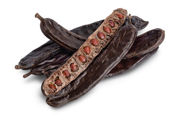Ripe carob pods and bean isolated on white background with clipping path and full depth of field - obrazy, fototapety, plakaty
