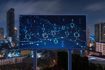 Information flow hologram on road billboard, night panorama city view of Bangkok. The largest technological center in Southeast Asia. The concept of programming science.