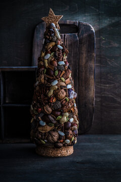 Rustic Christmas tree ornament made from fresh nuts and spices