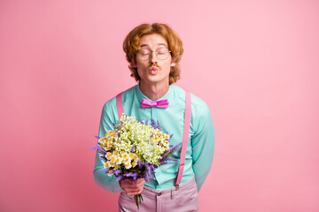 Photo portrait of gentleman with mustache red hair giving flowers kissing on date isolated on...