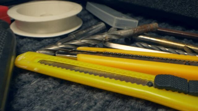 extremely close-up, detailed. repair tool kit in a box.