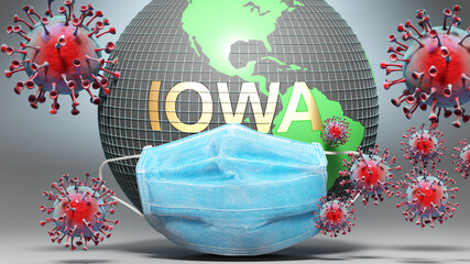 Iowa and covid - Earth globe protected with a blue mask against attacking corona viruses to show the relation between Iowa and current events, 3d illustration