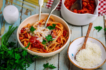 Bucatini all Amatriciana sauce with  Parmesan .selective focus
