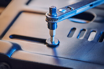 Hex wrench screws bolt in metal steel plate. tools and metal bolts. Fasteners concept and goods for repair.