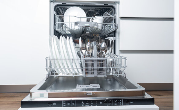 Open dishwasher with dishes inside
