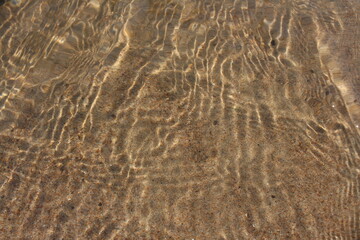 drawing waves on the sand in the sea texture of nature