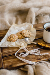 Wooden brown tray with cookies and tea.