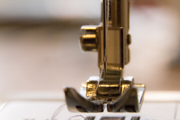 macro of a sewing machine's needle