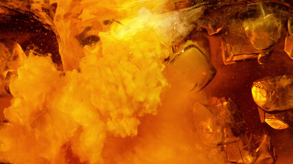 Detail of milk mixing into coffee drink wit ice cubes